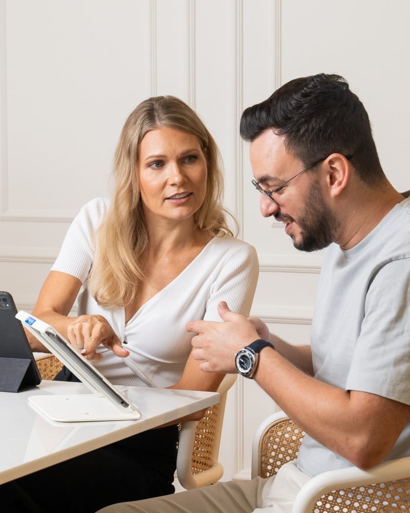 CompuCash team member showing CompuCash software to a client